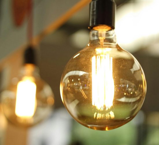 A close-up of a glowing vintage Edison bulb creating a warm atmosphere.
